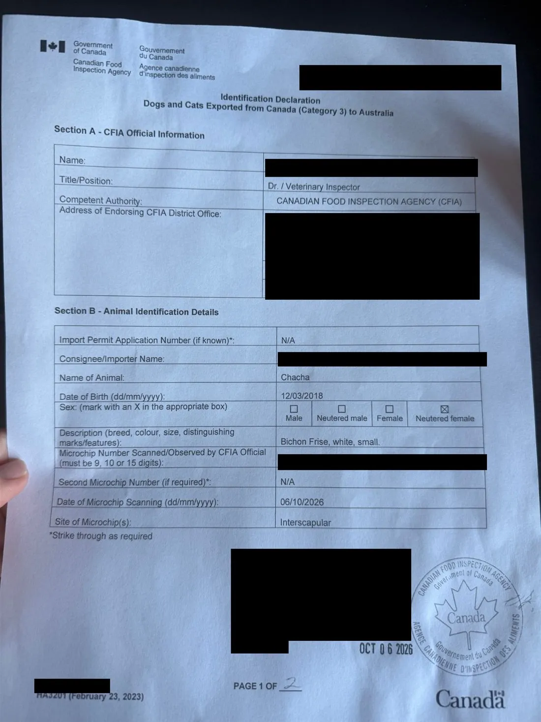 A photo of the CFIA Identification Declaration for dogs and cats exported from Canada (Category 3) to Australia. The name of the animal, the scan date of 06/10/2026 and the stamp date of 6 October 2026 are visible. The reference number, names, address, microchip number and signature are covered with black boxes.